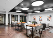 Thumbnail 17 of 53 - a large room with tables and chairs